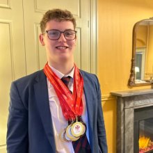 Lewis Wins 8 Medals at Regional Swim Championships 