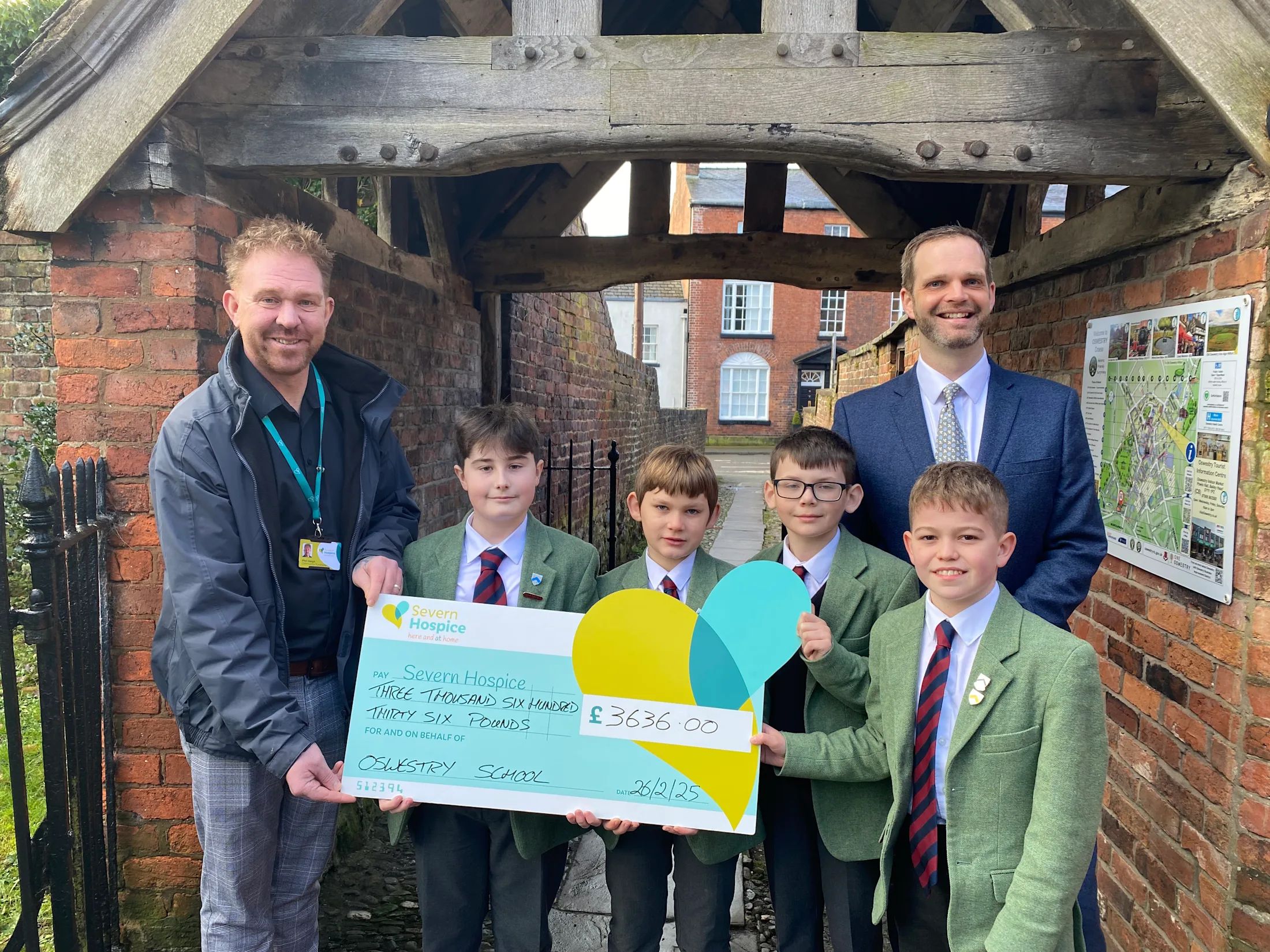 Severn Hospice receives donation cheque from Oswestry School Fundraisers 